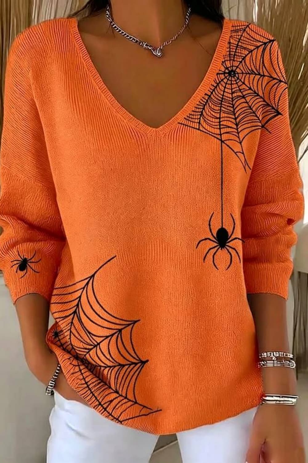 Evangeline | Halloween-Inspired Orange Spider Web Print V Neck Long Sleeve Sweater